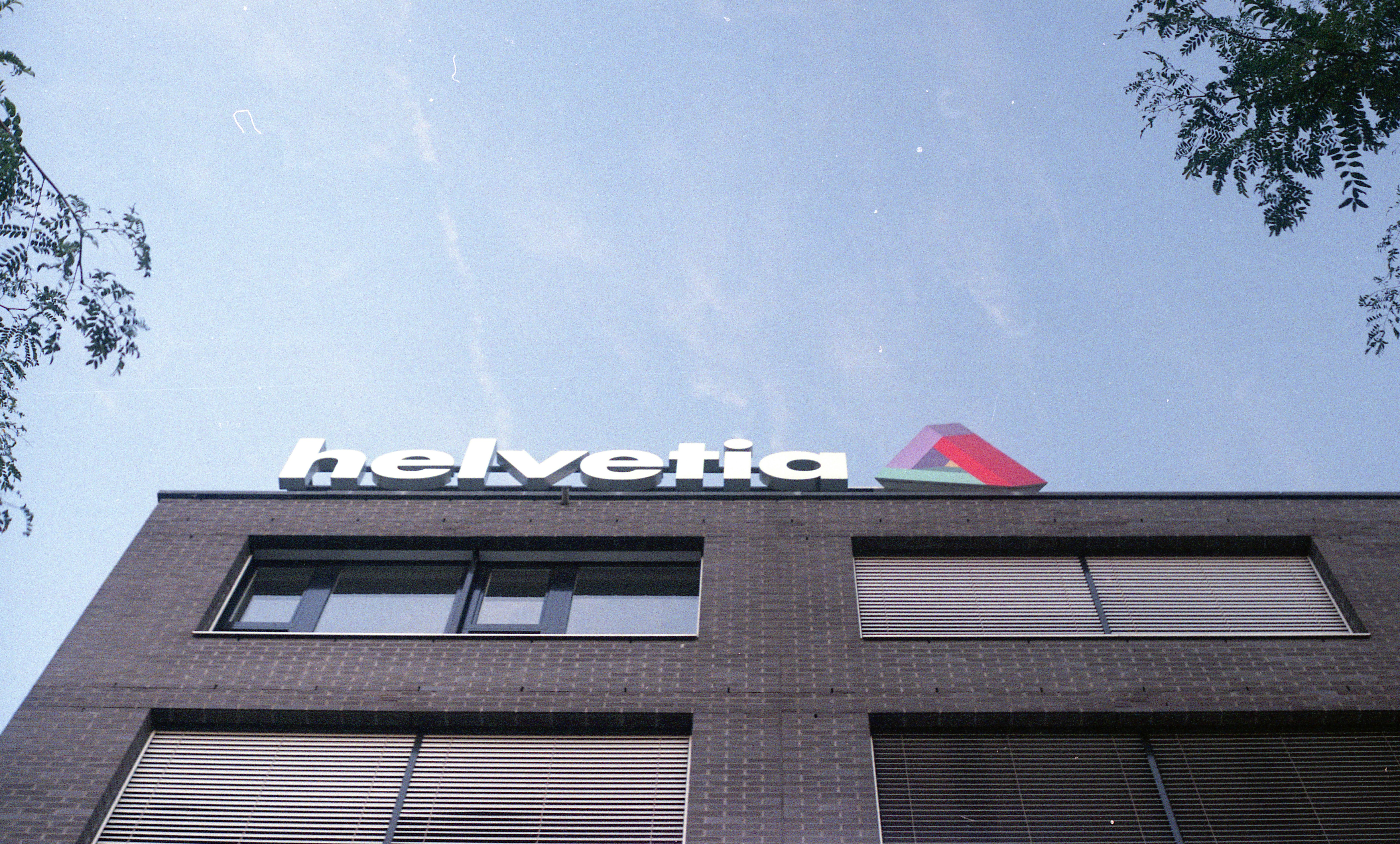 a tall building with a sign on top of it