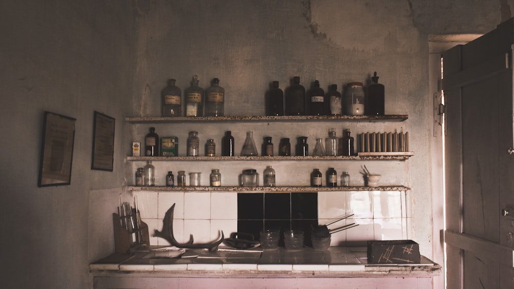 a kitchen filled with lots of bottles and knives