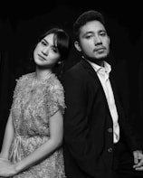 a man and a woman standing next to each other