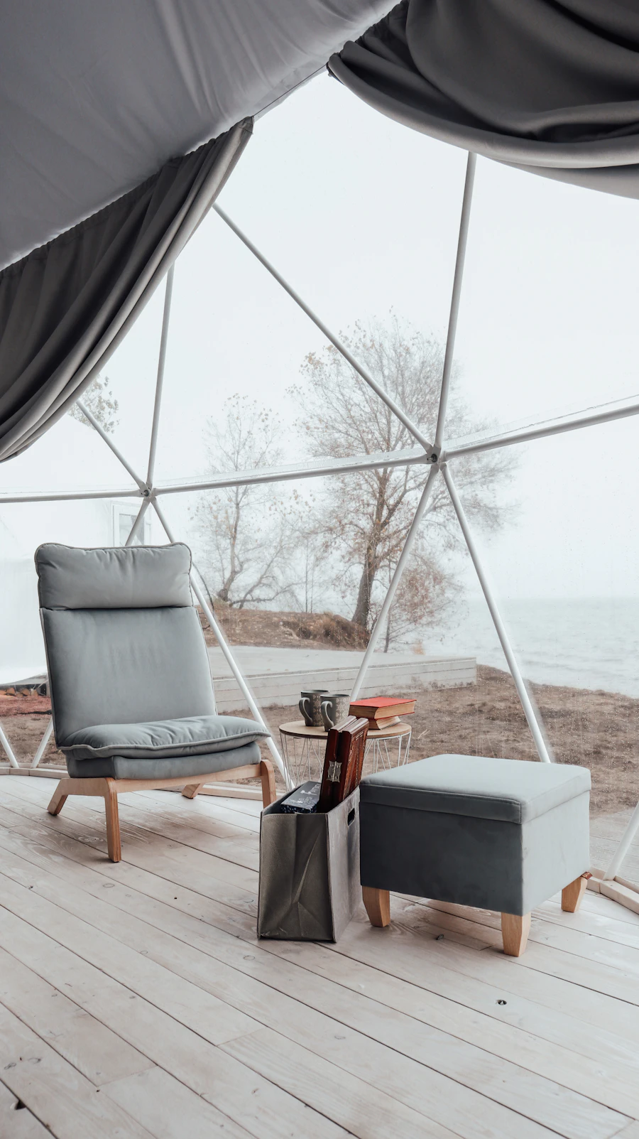 Luxury glamping tent interior with furniture and warm lighting