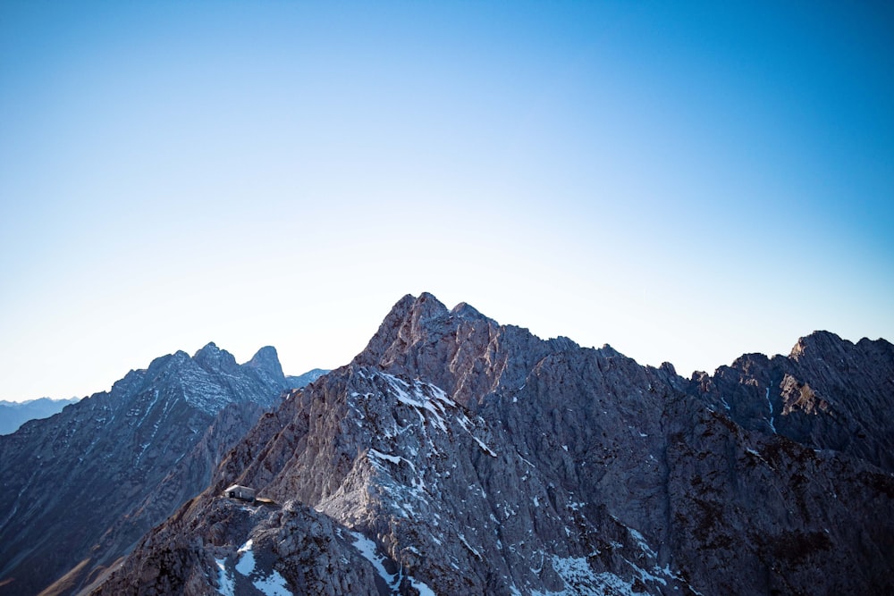 a view of a mountain range from the top of a mountain