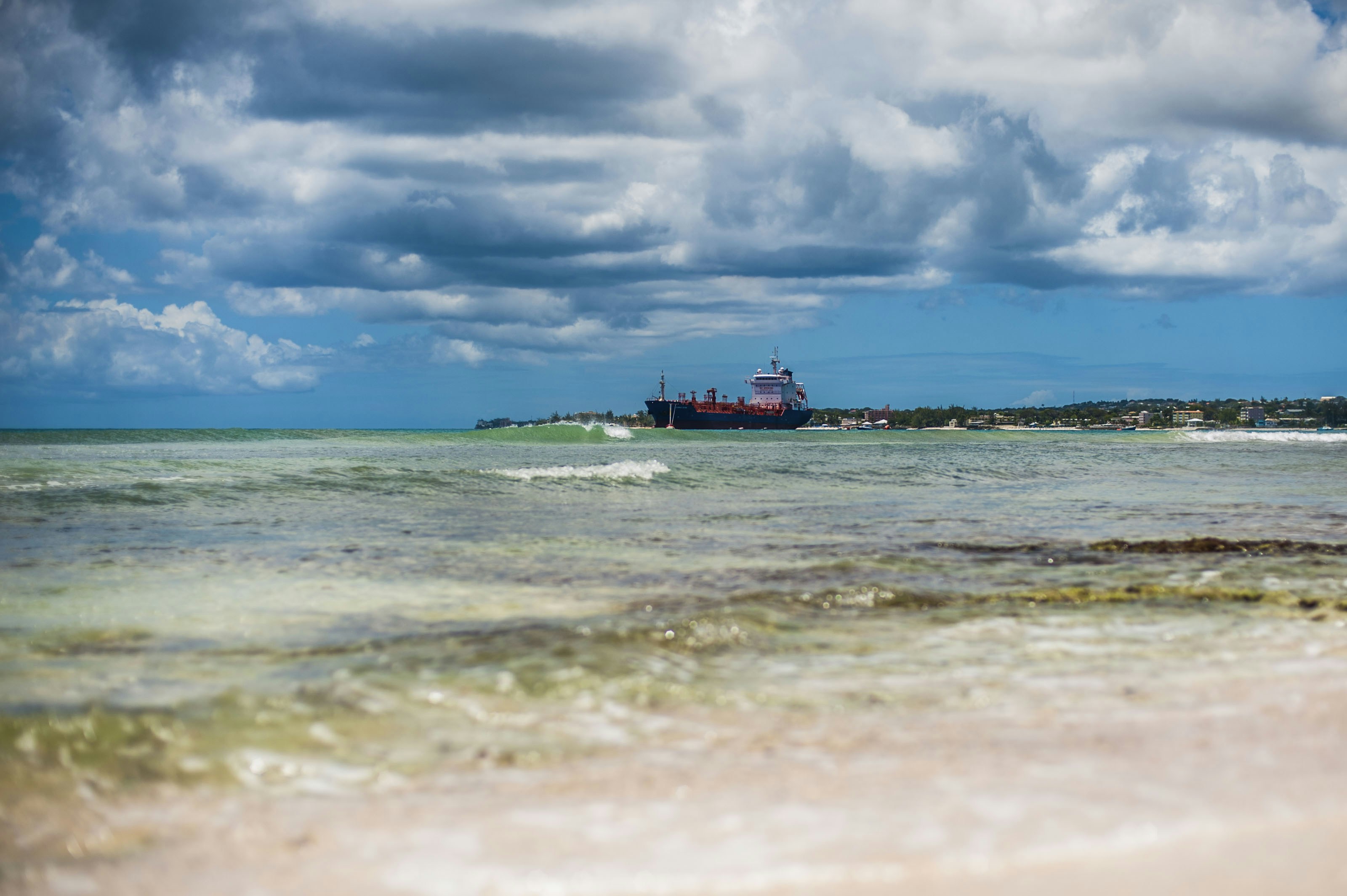 a large boat in the middle of a body of water, 
