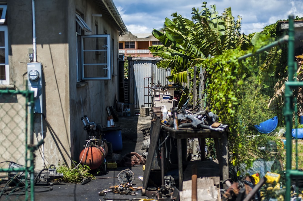 a back yard with a lot of junk on the ground