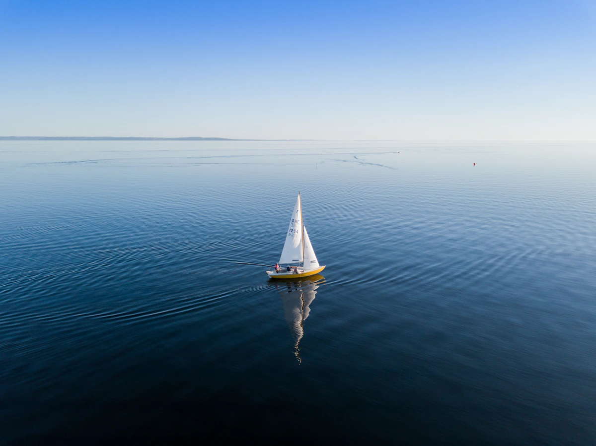 A sailing catamaran under way on open water
