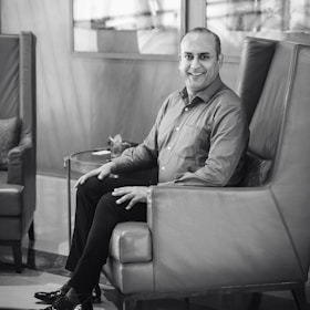 A relaxed man enjoying a peaceful moment at home, symbolizing comfort and relief.