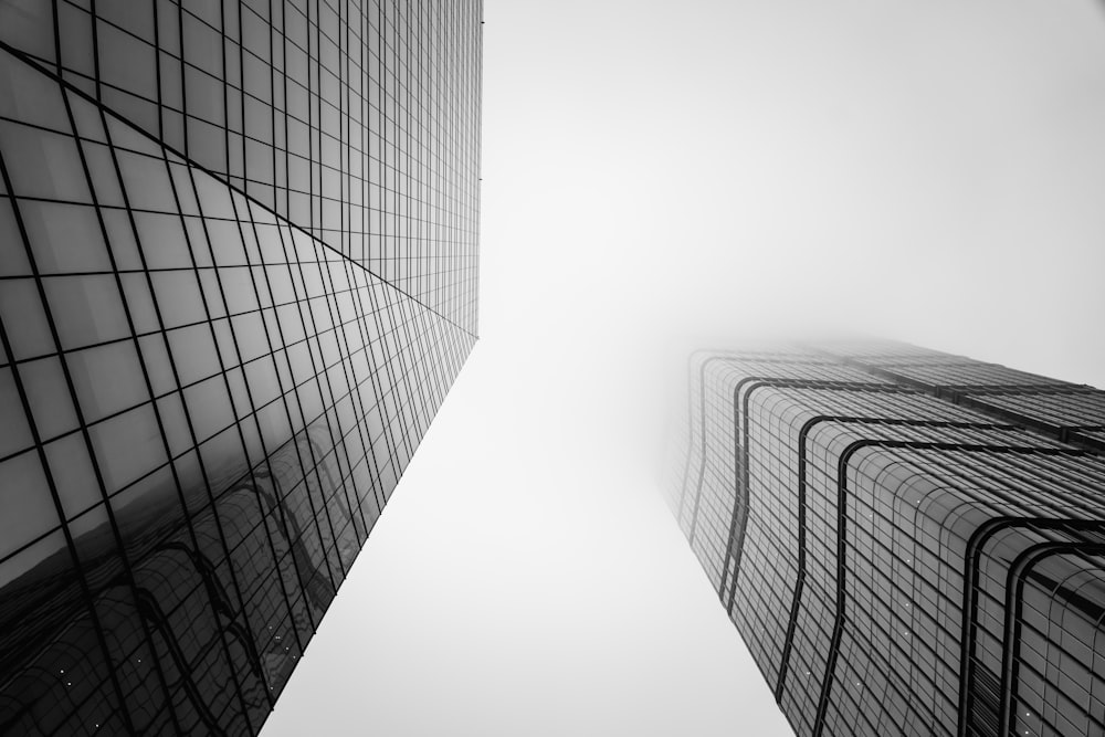 a black and white photo of tall buildings