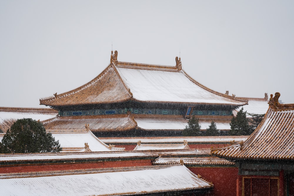 a building with a roof covered in snow