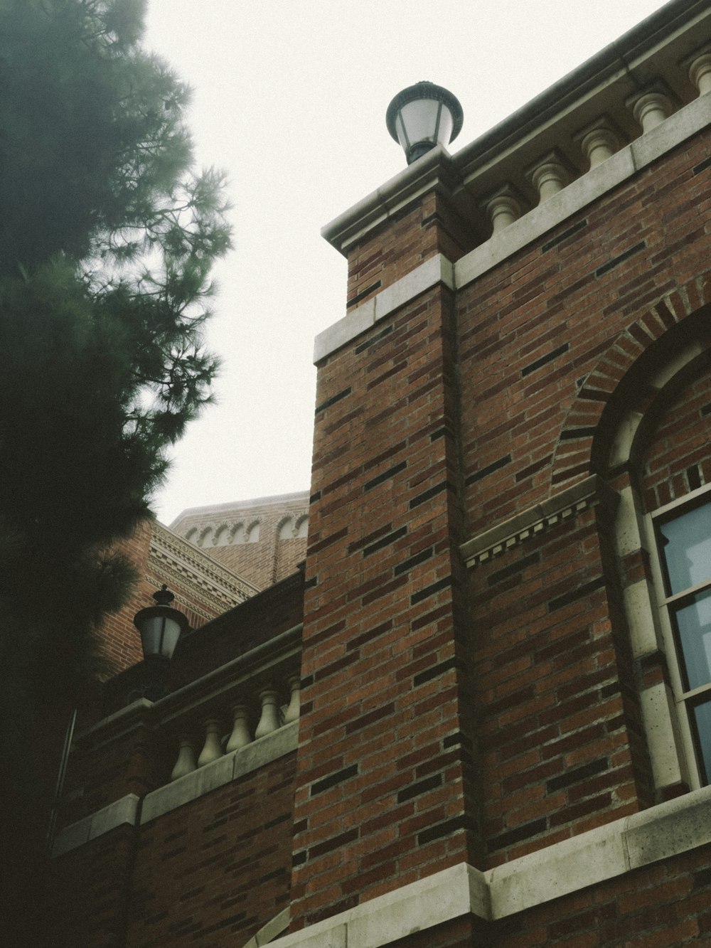 a brick building with a light on top of it