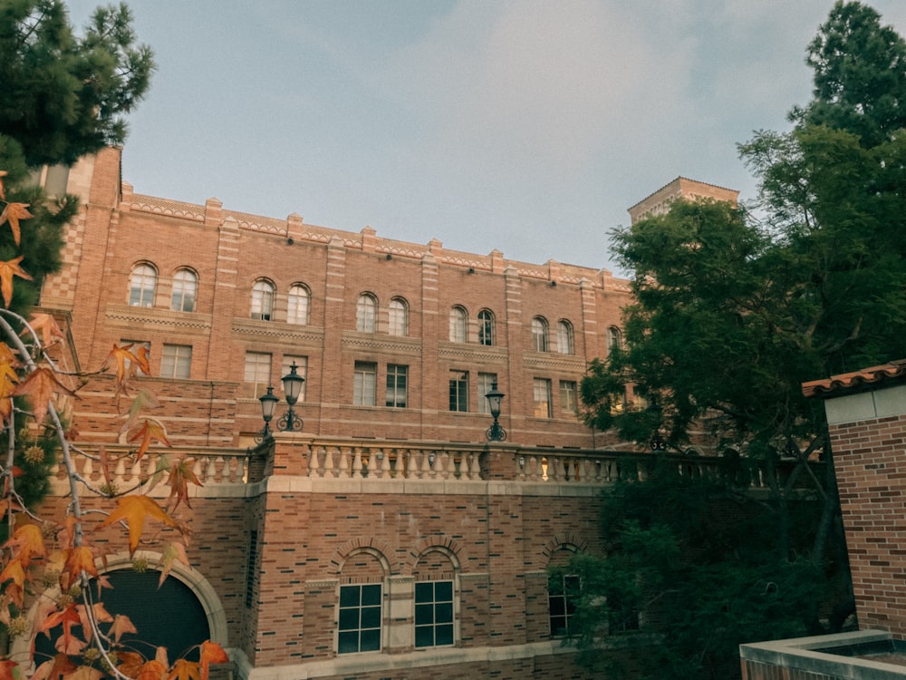 a large brick building with a clock on the front of it