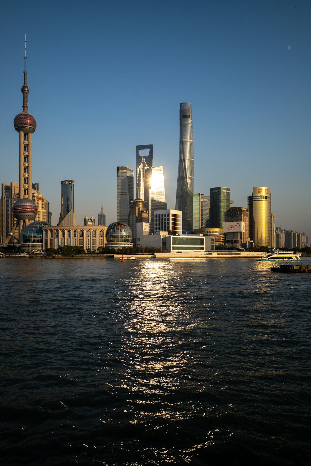 a large body of water with a city in the background