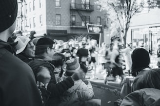 A vibrant photo of runners sprinting through a city park during a sunny 5k race.