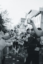 a group of people standing around each other