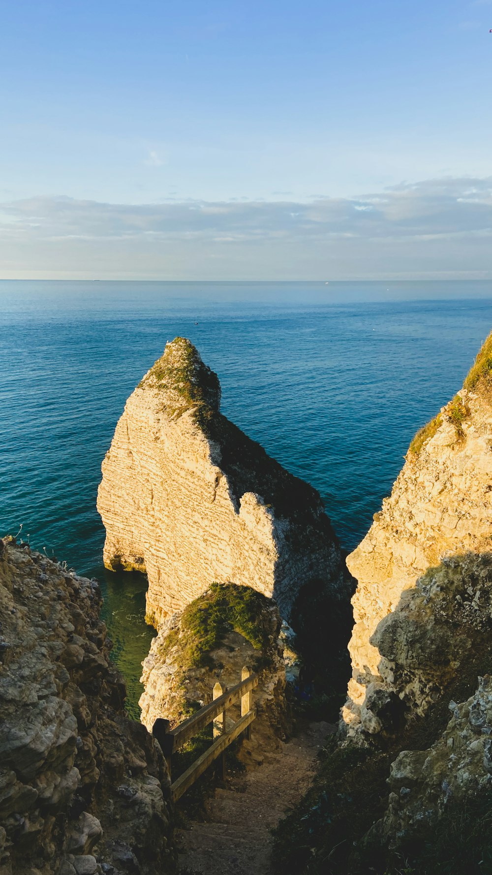 a view of the ocean from the top of a cliff