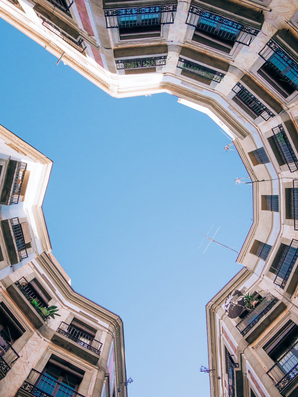 looking up at the sky from the bottom of a building