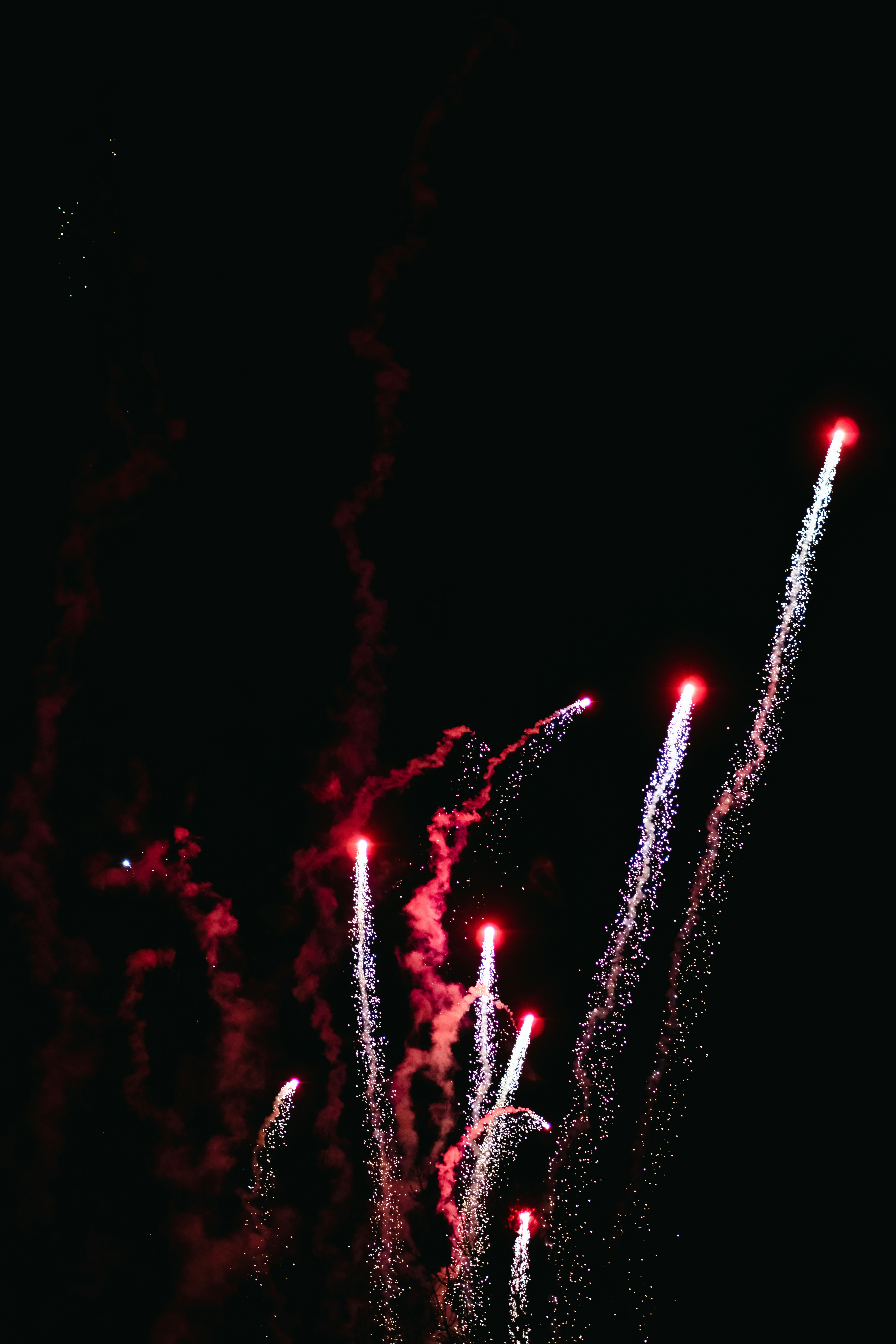a bunch of fireworks are lit up in the night sky