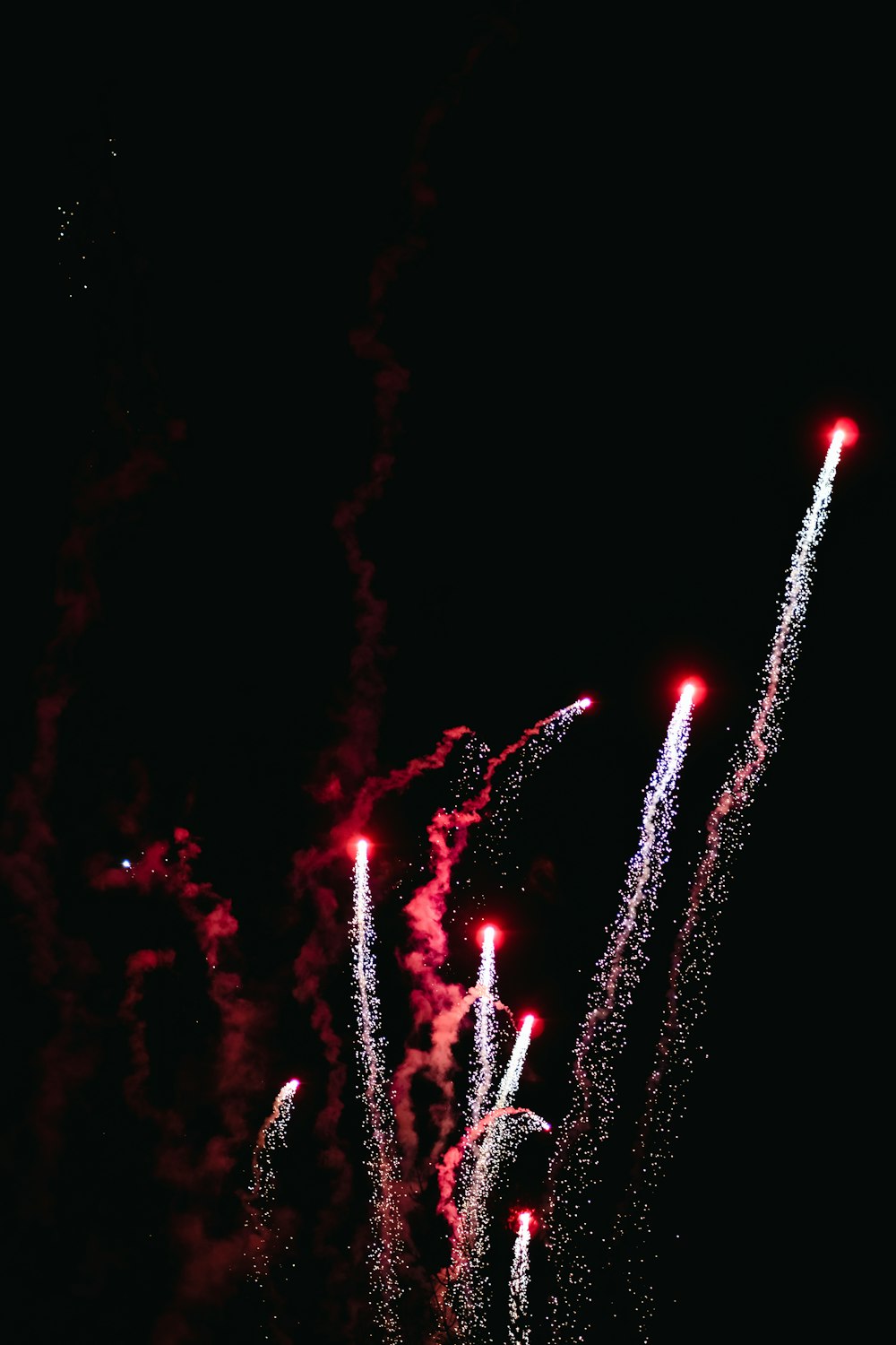 a bunch of fireworks are lit up in the night sky