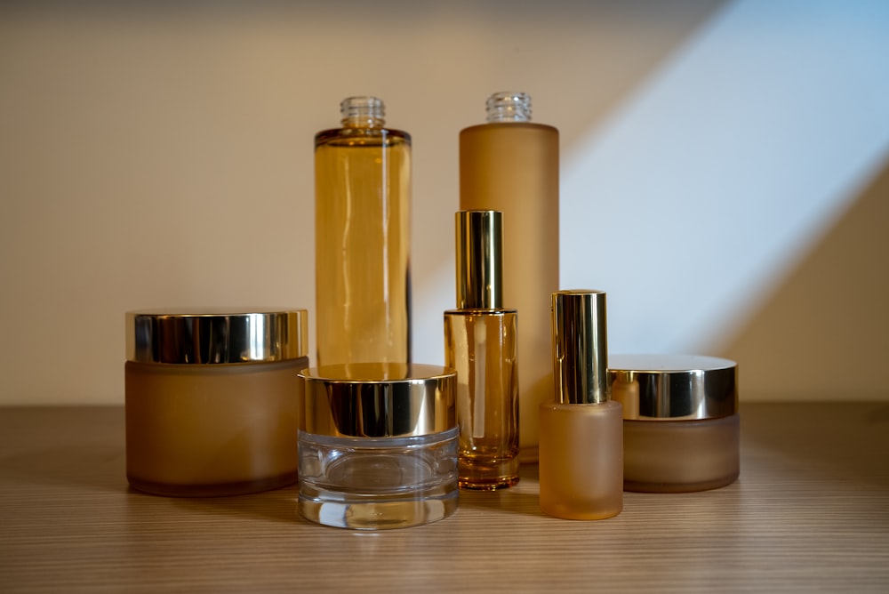 a group of bottles sitting on top of a wooden table