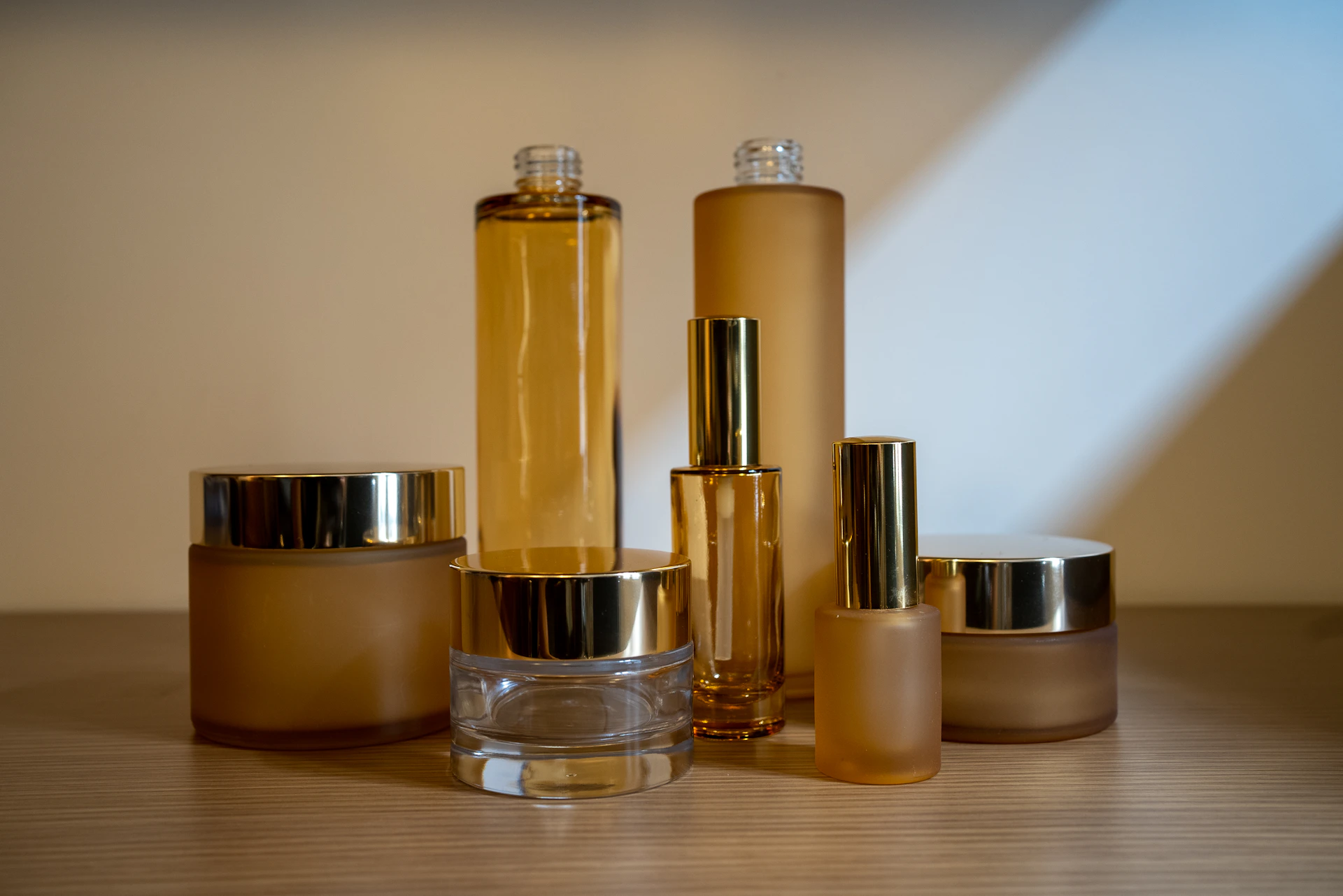 a group of bottles sitting on top of a wooden table