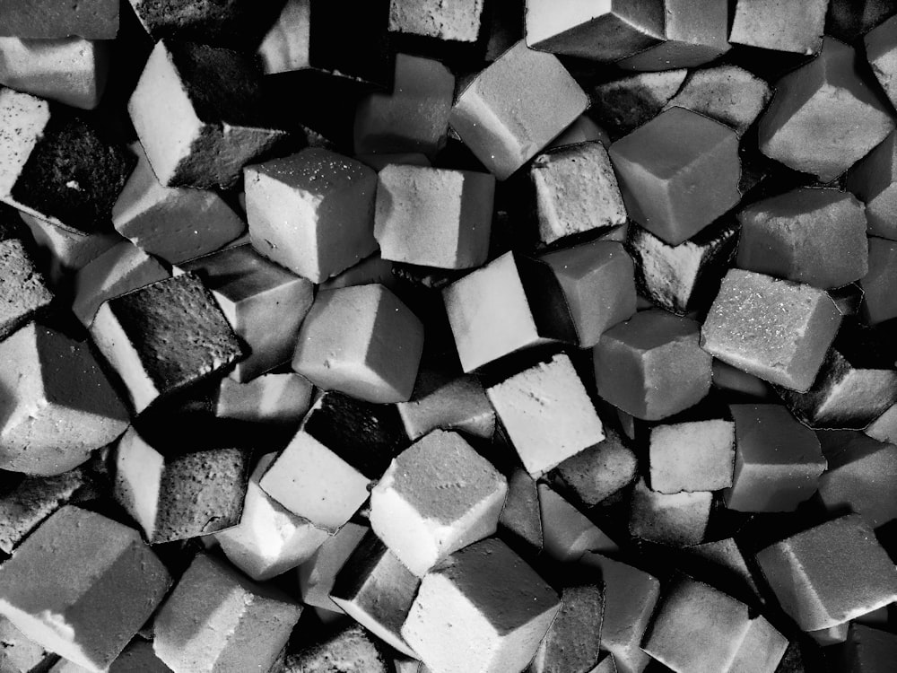 a black and white photo of a pile of cubes