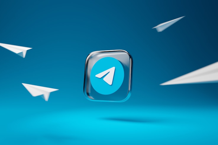 a blue chatbot telegram button with a white arrow on it