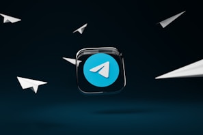 a blue button with a white arrow on it