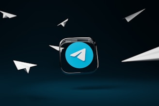 a blue button with a white arrow on it