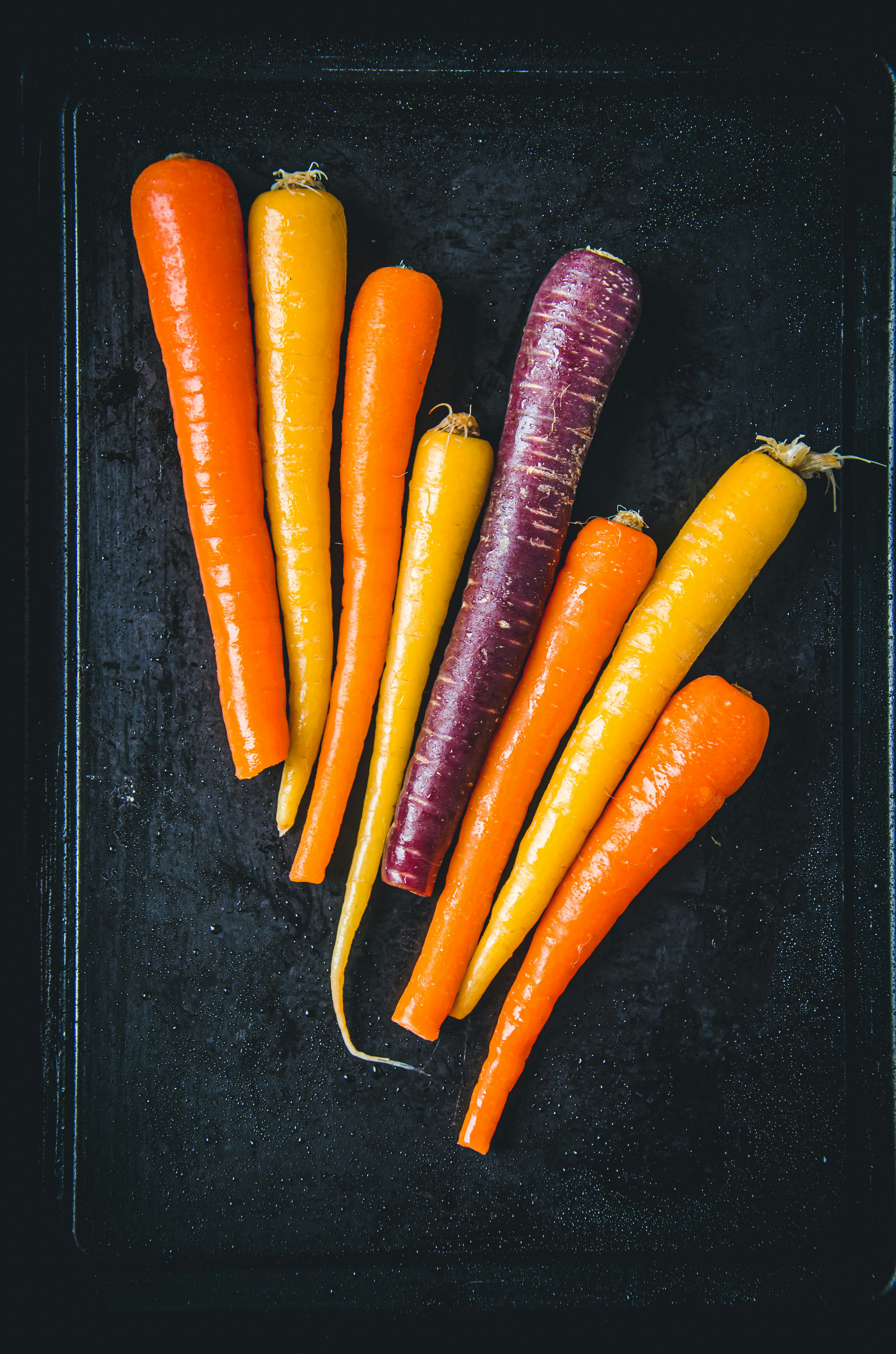 a bunch of carrots are on a tray