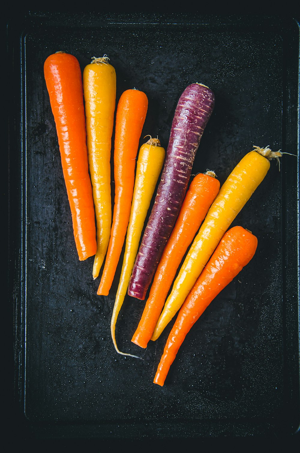 a bunch of carrots are on a tray