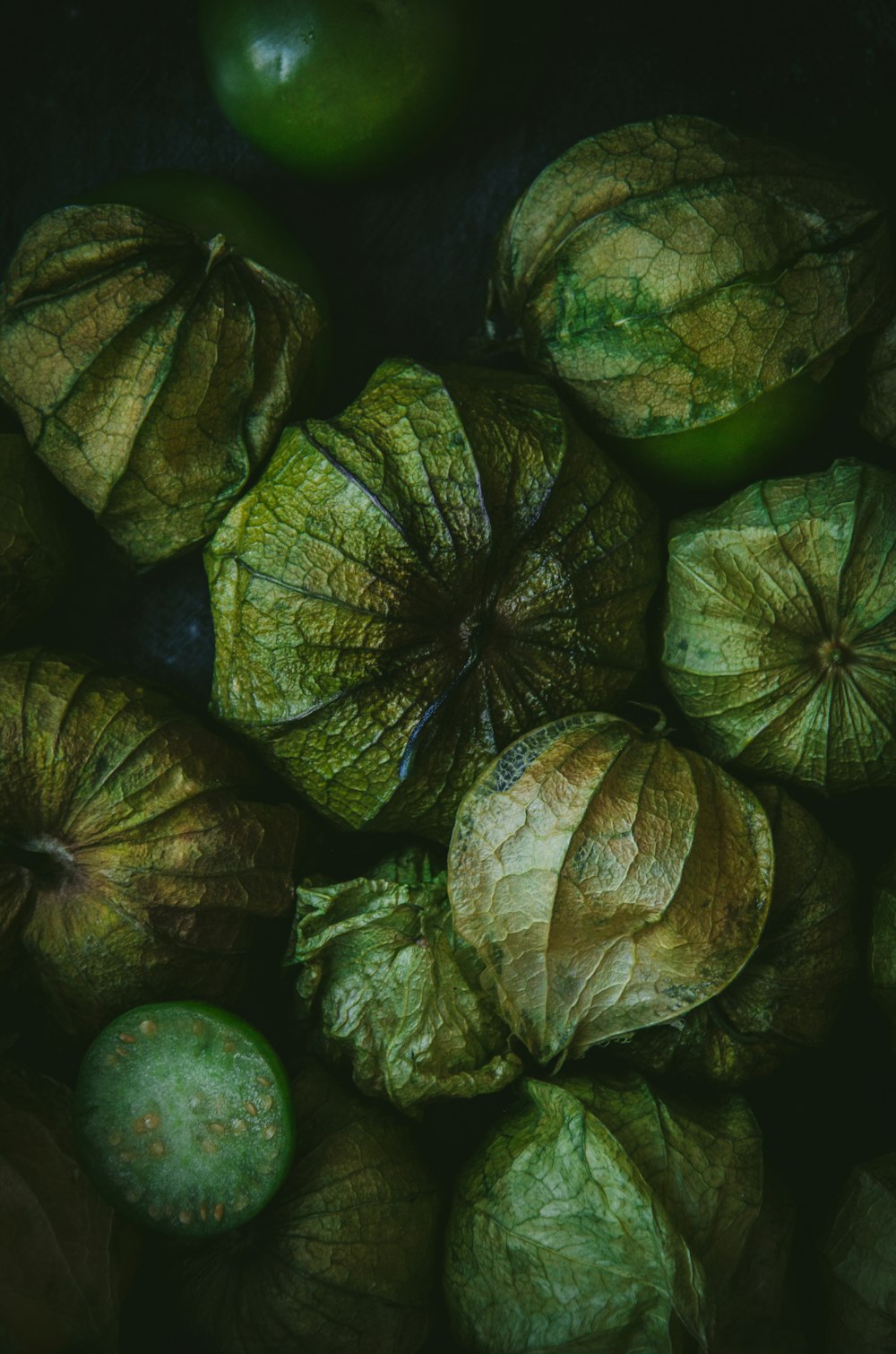 a pile of green fruit sitting next to each other