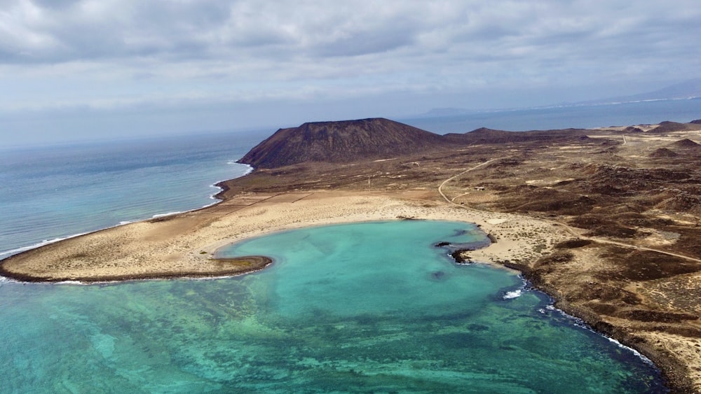 an aerial view of an island in the middle of the ocean