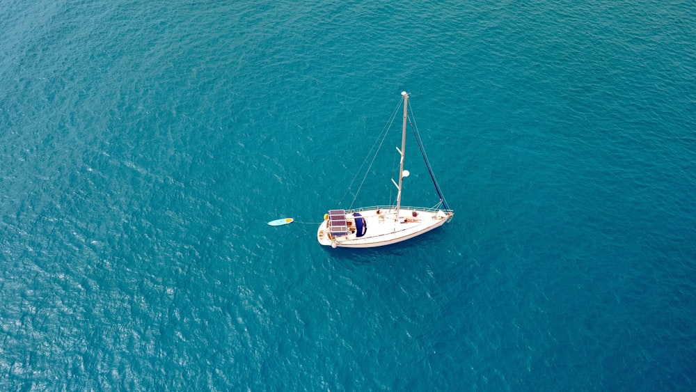 a sailboat in the middle of the ocean