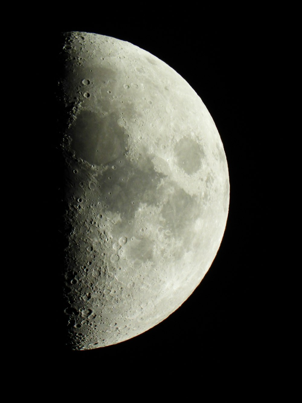 a close up of a half moon in the sky