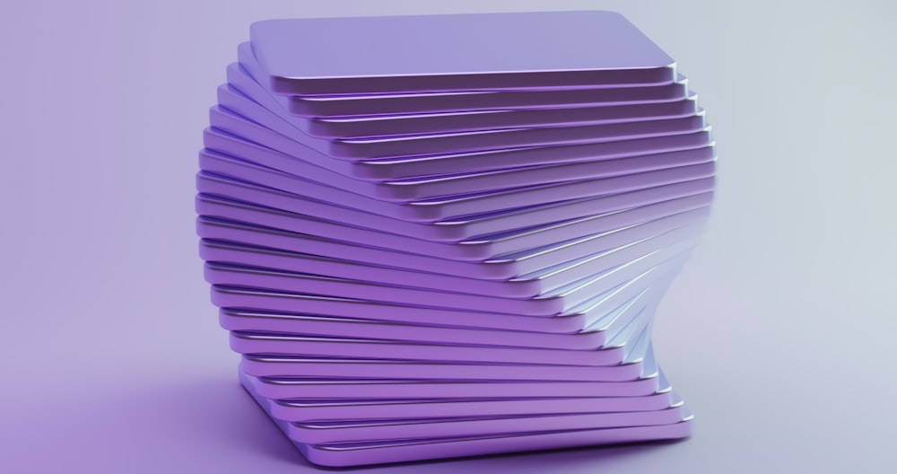 a stack of purple plastic objects on a purple background
