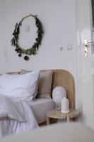Chic bedroom corner with a minimalist bed frame and soft, inviting linens.