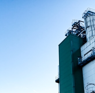 a factory building with a sky background