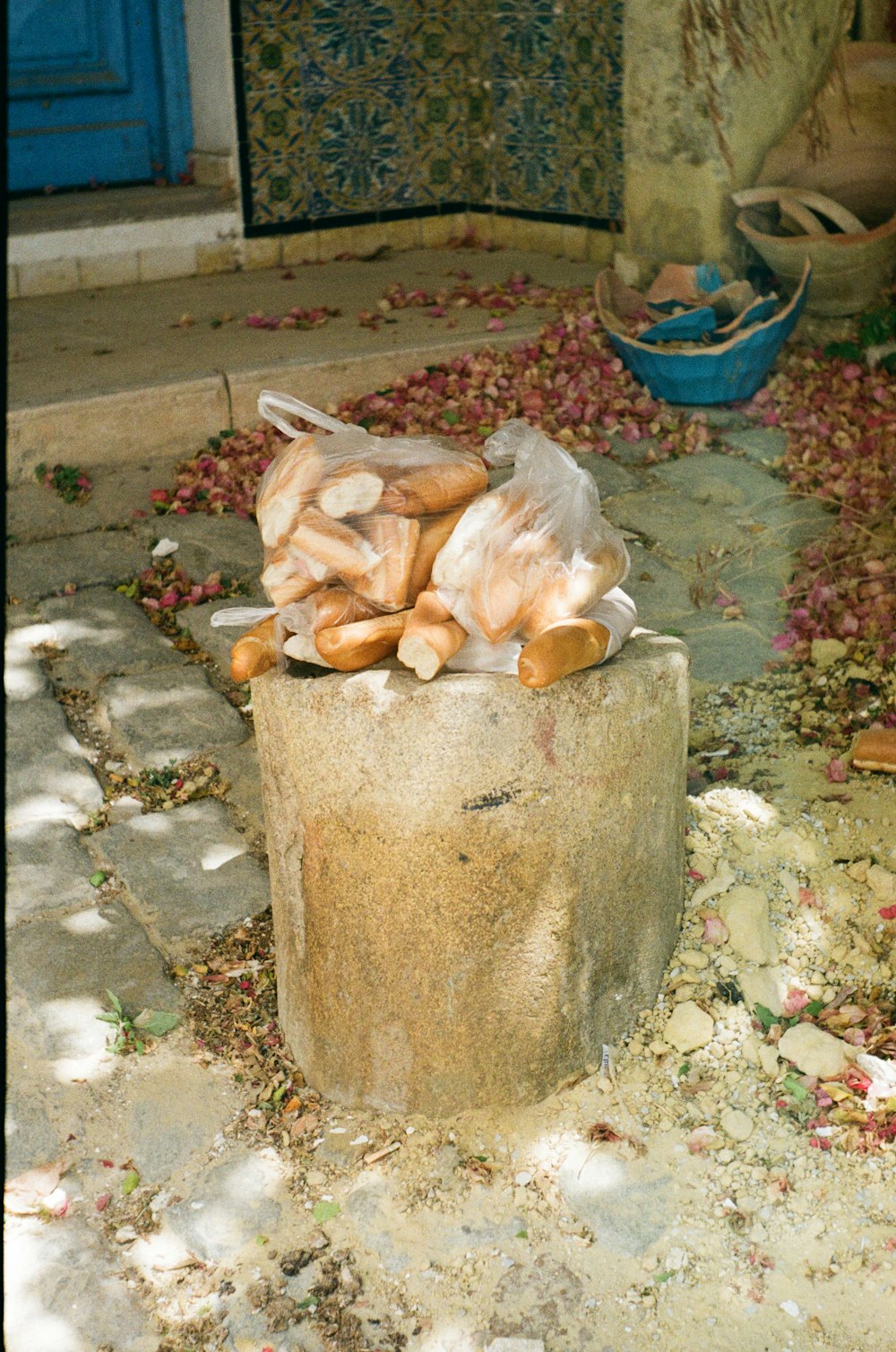a pile of bread sitting on top of a cement slab
