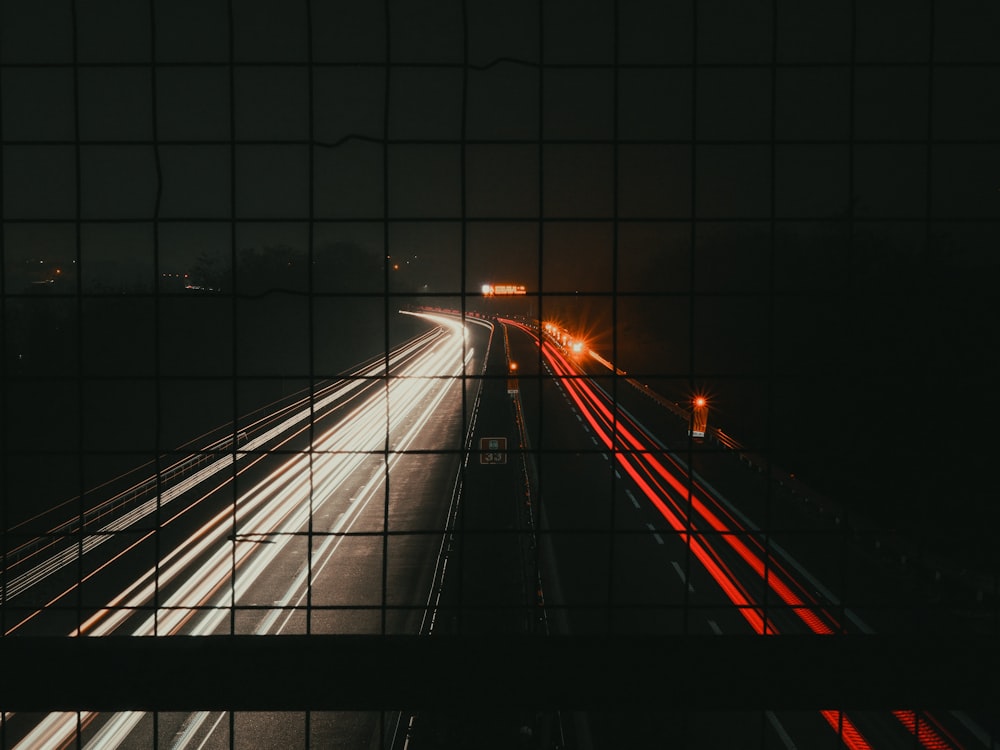 a view of a highway at night from a bridge