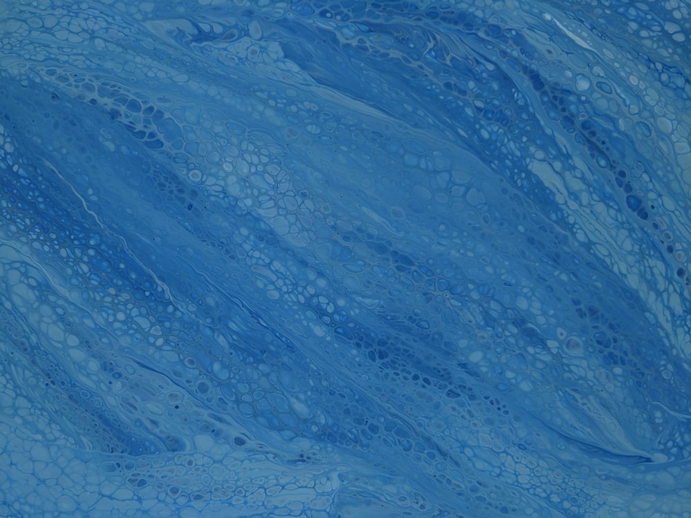 a painting of blue water with bubbles