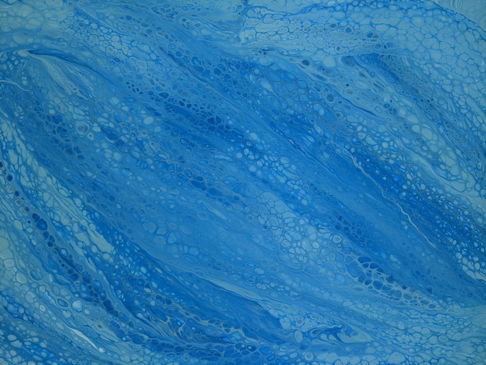 a painting of blue water with bubbles on it