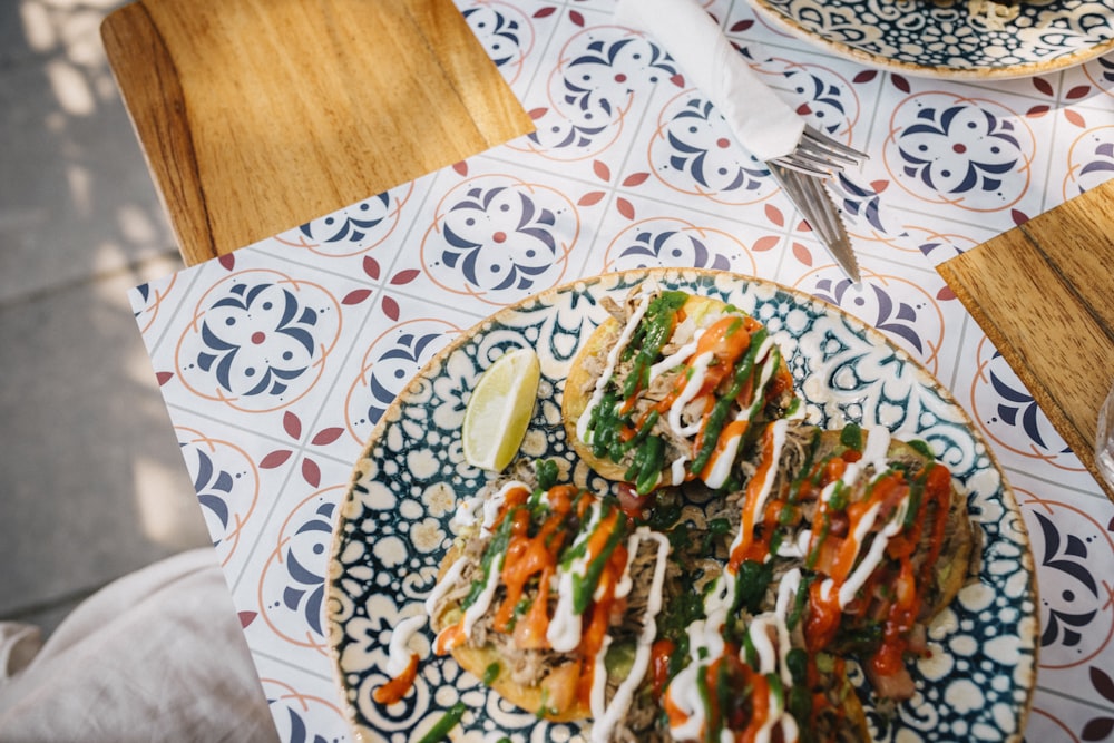 a plate of food sitting on top of a table