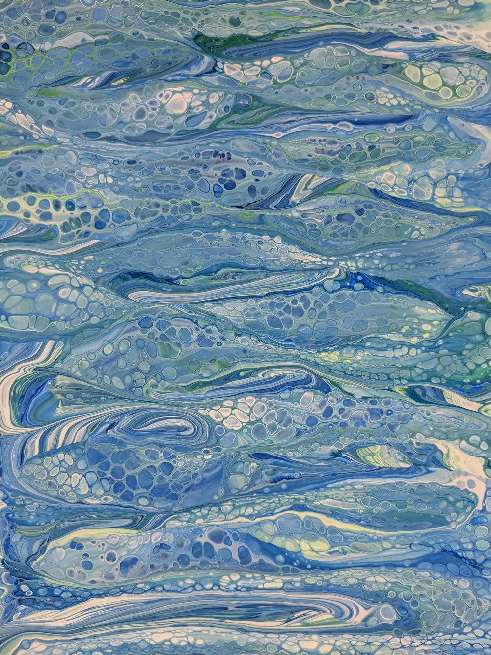 a painting of blue and green water with bubbles