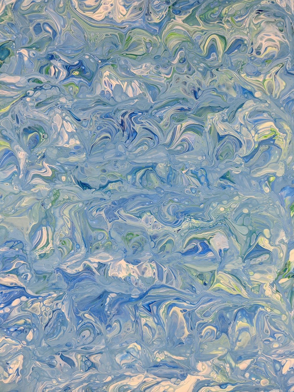 an abstract painting of blue and green colors