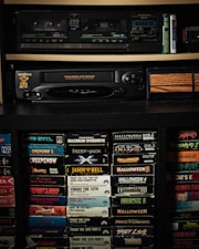 a shelf with a bunch of movies on it