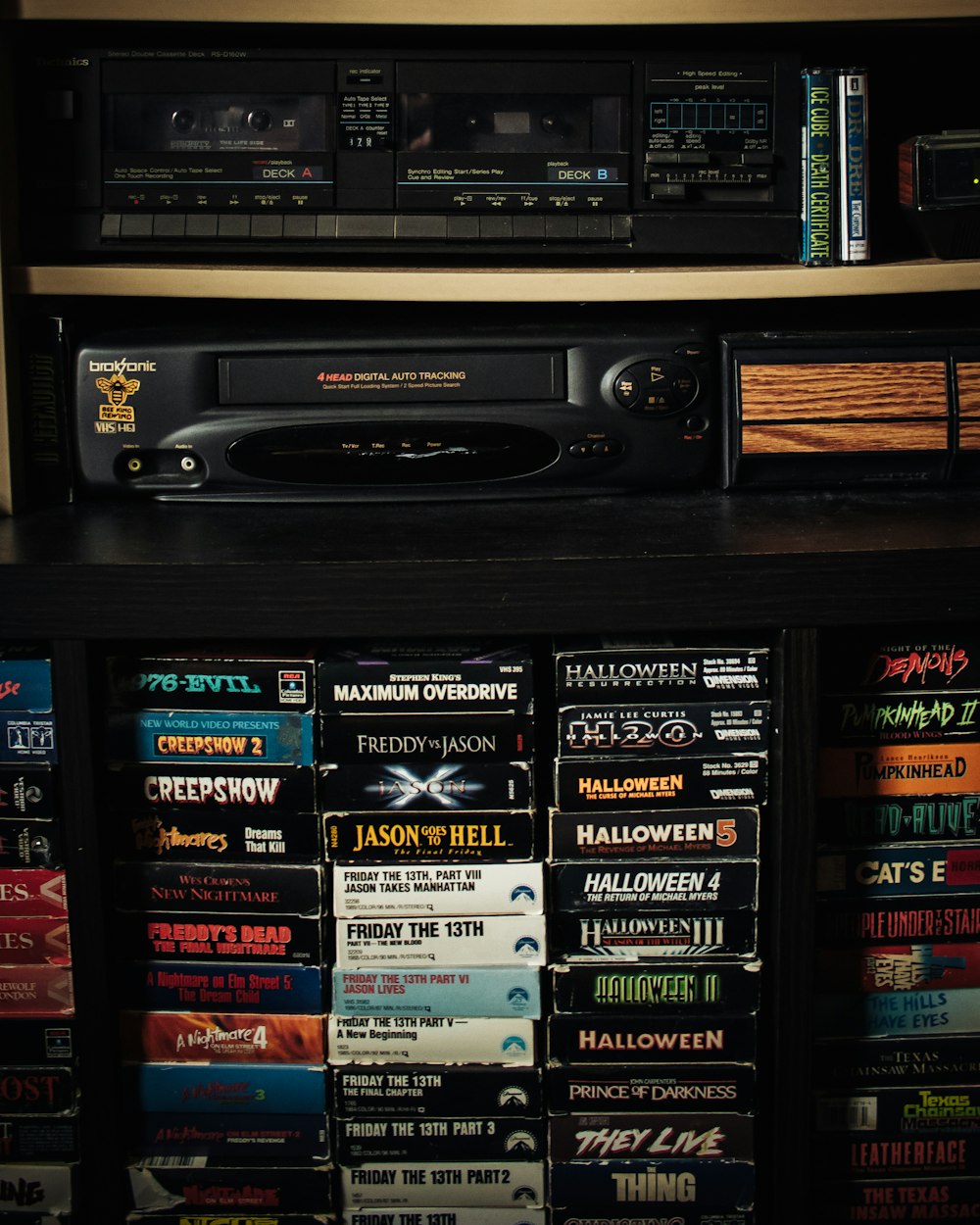 a shelf with a bunch of movies on it