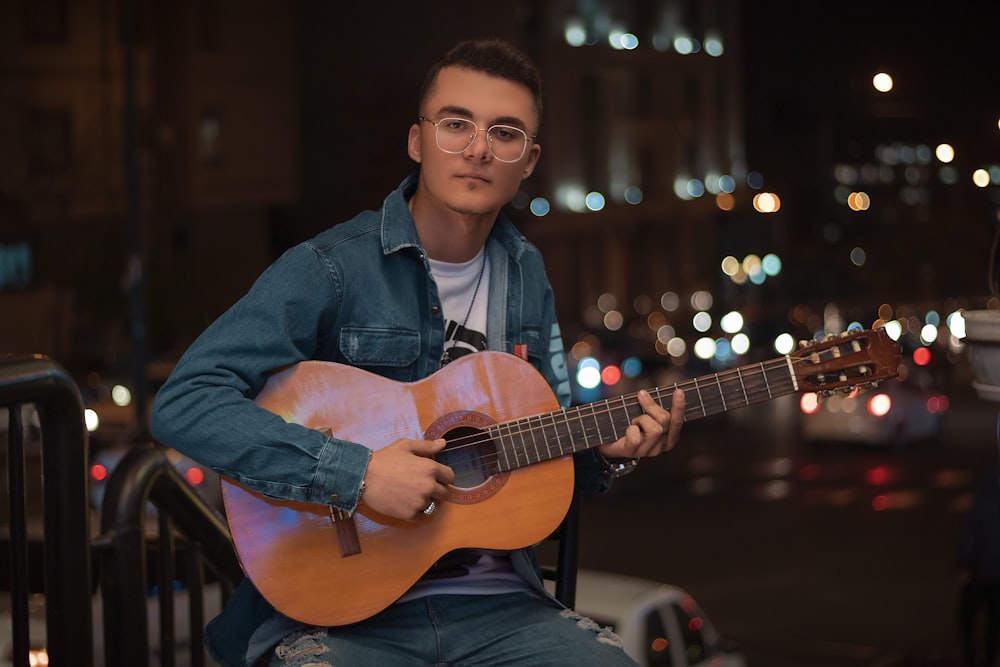 a person holding a guitar