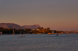 a body of water with boats floating on top of it