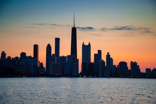 a view of a city skyline at sunset