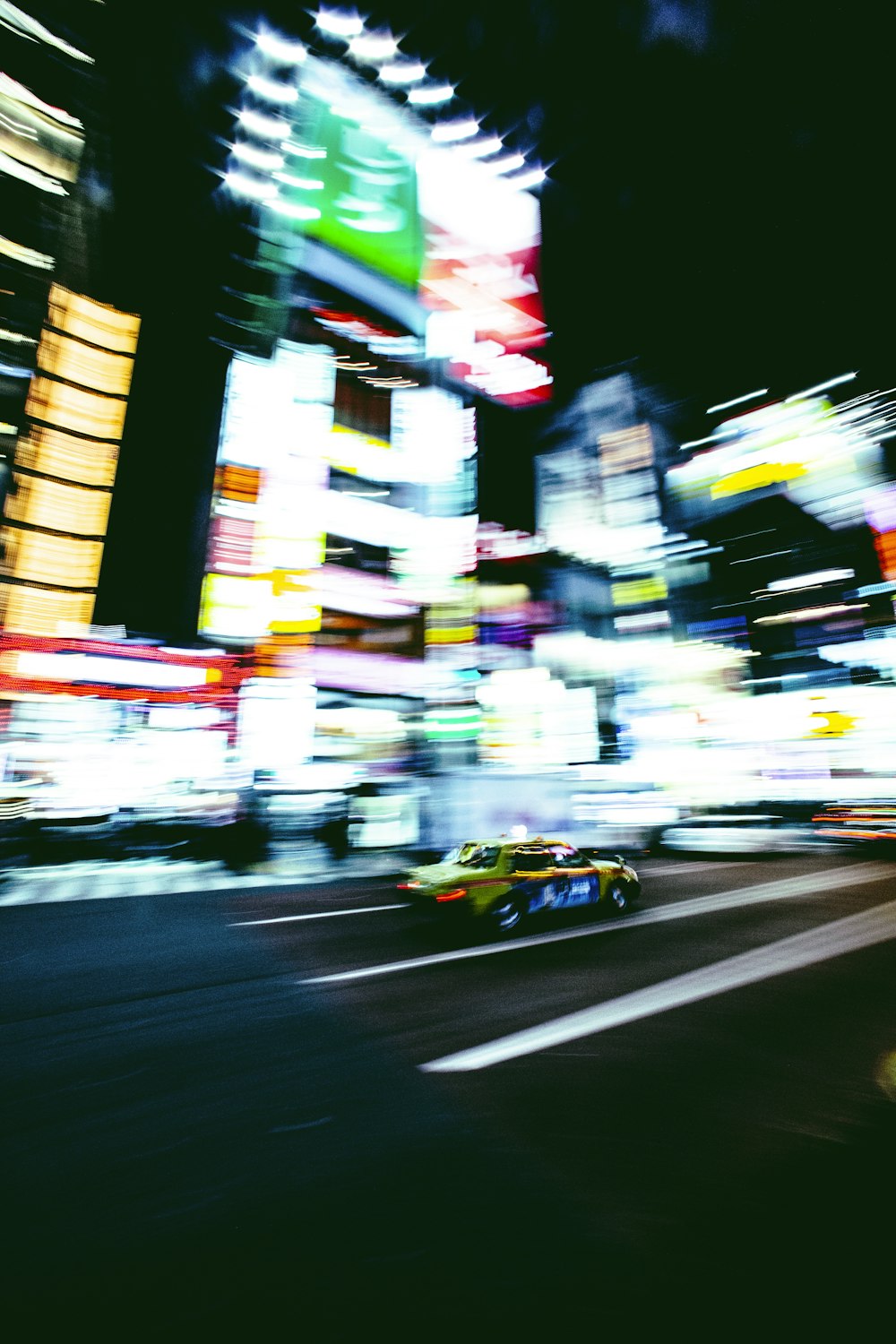 a blurry photo of a city street at night