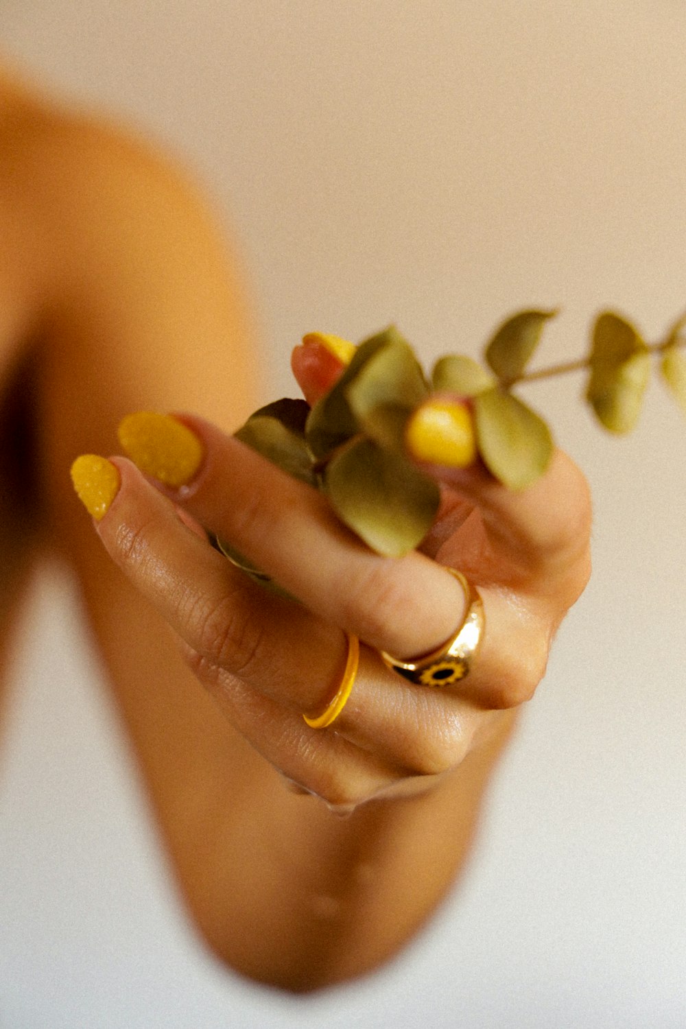 a woman holding a flower in her hand