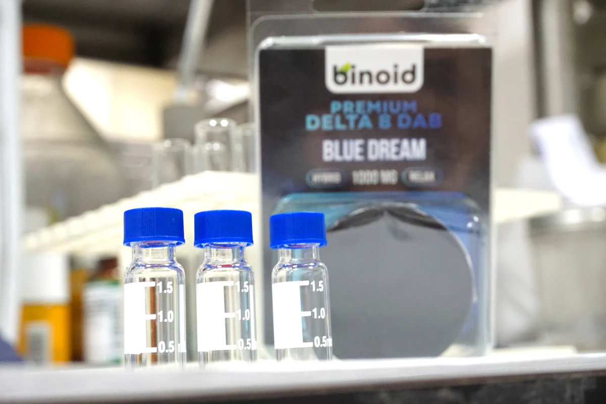 Laboratory bottles used to illustrate cannabinoid testing and differences between cannabis compounds